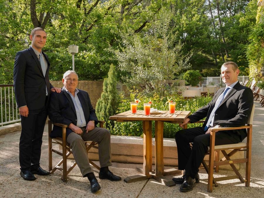 Three businessman having beverages at Villa Borghese