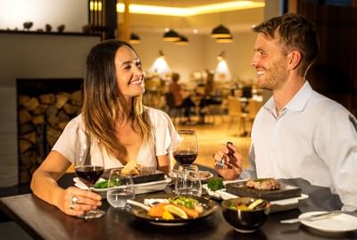 Couple having meal at the restaurant at Cradle Mountain Hotel