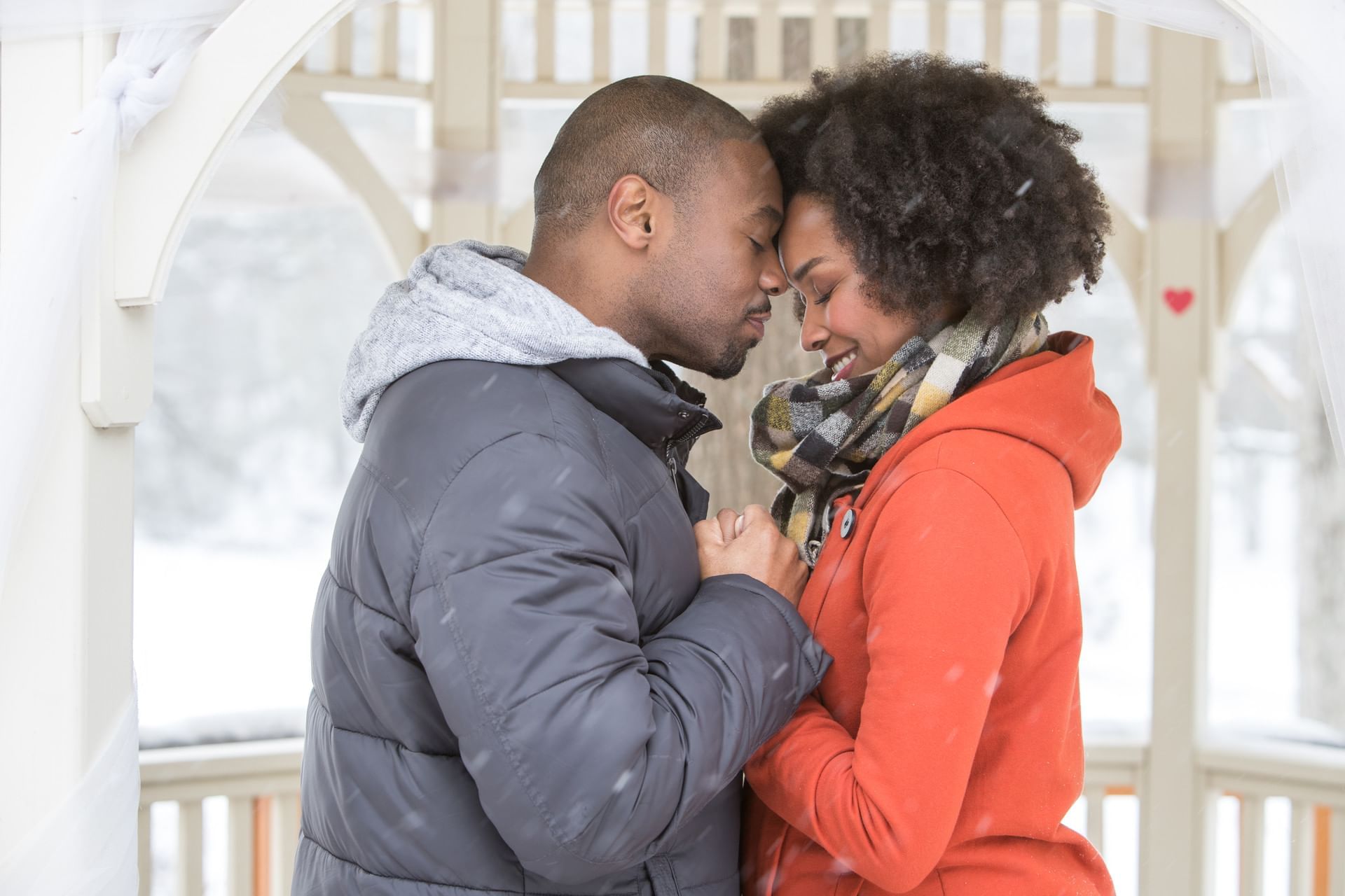 Couple kissing each other at Cove Haven Resort in winter