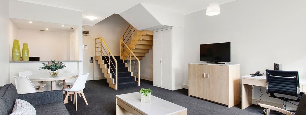 Luxury living area with amenities in Mercure Loft Suite at Pullman Albert Park