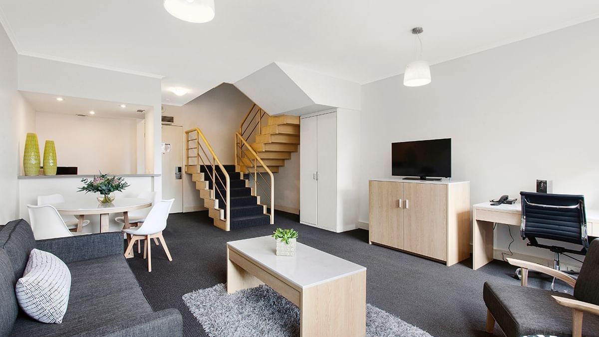 Luxury living area with amenities in Mercure Loft Suite at Pullman Albert Park
