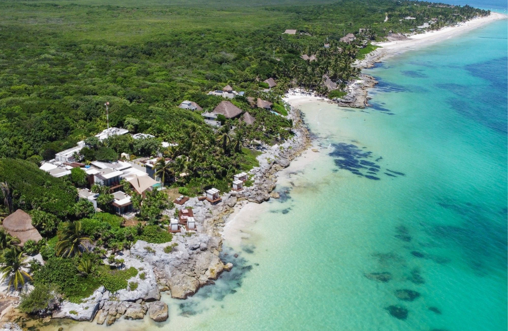 Aerial view of Mi Amor's rocky Caribbean setting and the surrounding Tulum coast