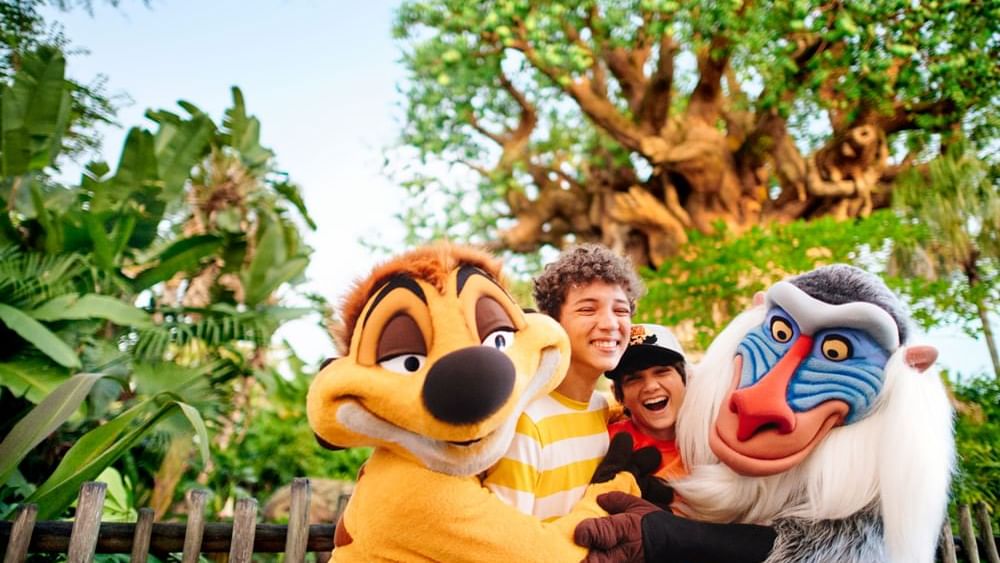Two people posing by Disney’s Animal Kingdom Theme Park near Lake Buena Vista Resort Village & Spa