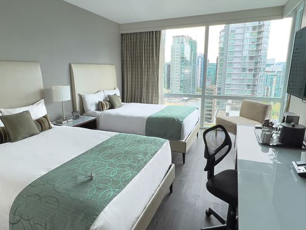 Room with two doubles with tv and desk