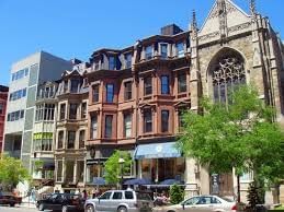 Cars parked on Newbury Street, Downtown Boston shopping near Eliot Hotel, captured during daytime