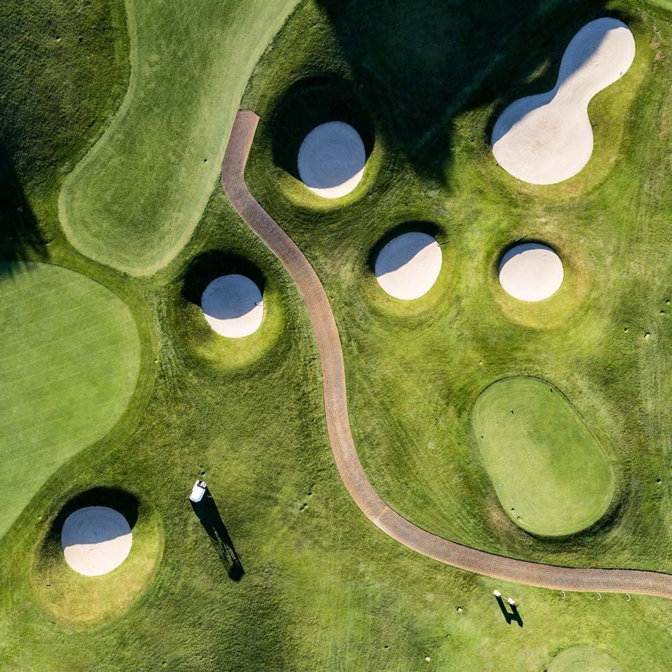 Aerial view of a golf course near Falkensteiner Hotels