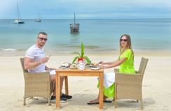 A couple having lunch by the sea at Zanzibar Serena Hotel