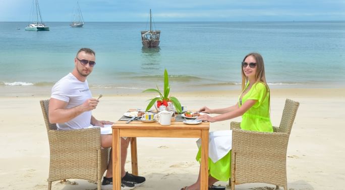A couple having lunch by the sea at Zanzibar Serena Hotel