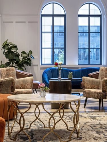 Allerton Hotel Lobby Lounge with orange sofas and patterned chairs surrounding a table at Warwick Allerton Chicago