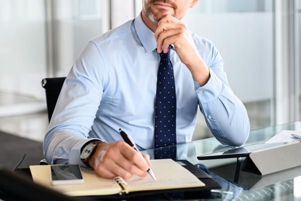 Man going through his offsite meeting checklist