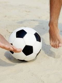 Two people playing football