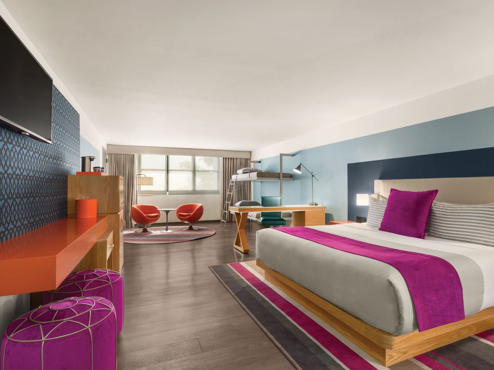 TRYP by Wyndham Isla Verde hotel room with kind bed, bunk beds and desk