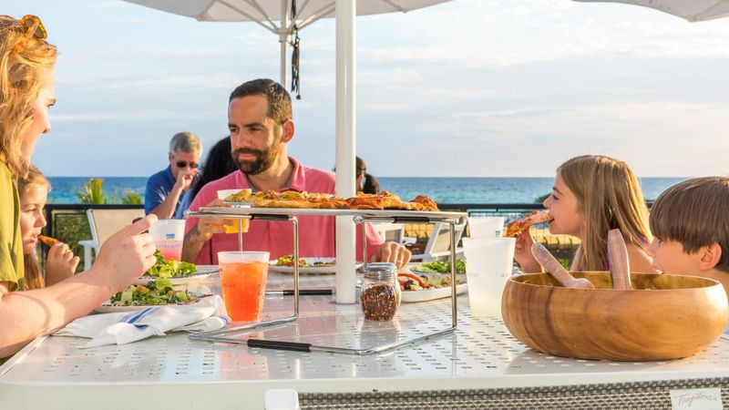 A family dining in WaterColor Grill at WaterColor Inn