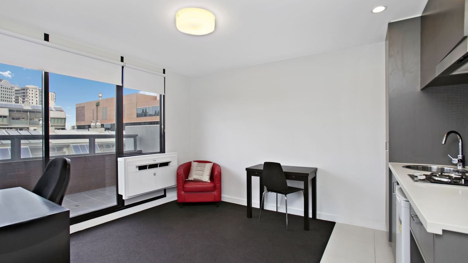 Self-contained one bedroom balcony apartment - lounge & kitchen view