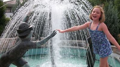 A Little Girl in front of the fountain near Marv Herzog Hotel