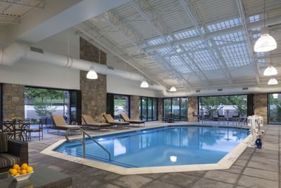 Indoor pool with lounge chairs and skylights at Aramark Chauncey Conference Center