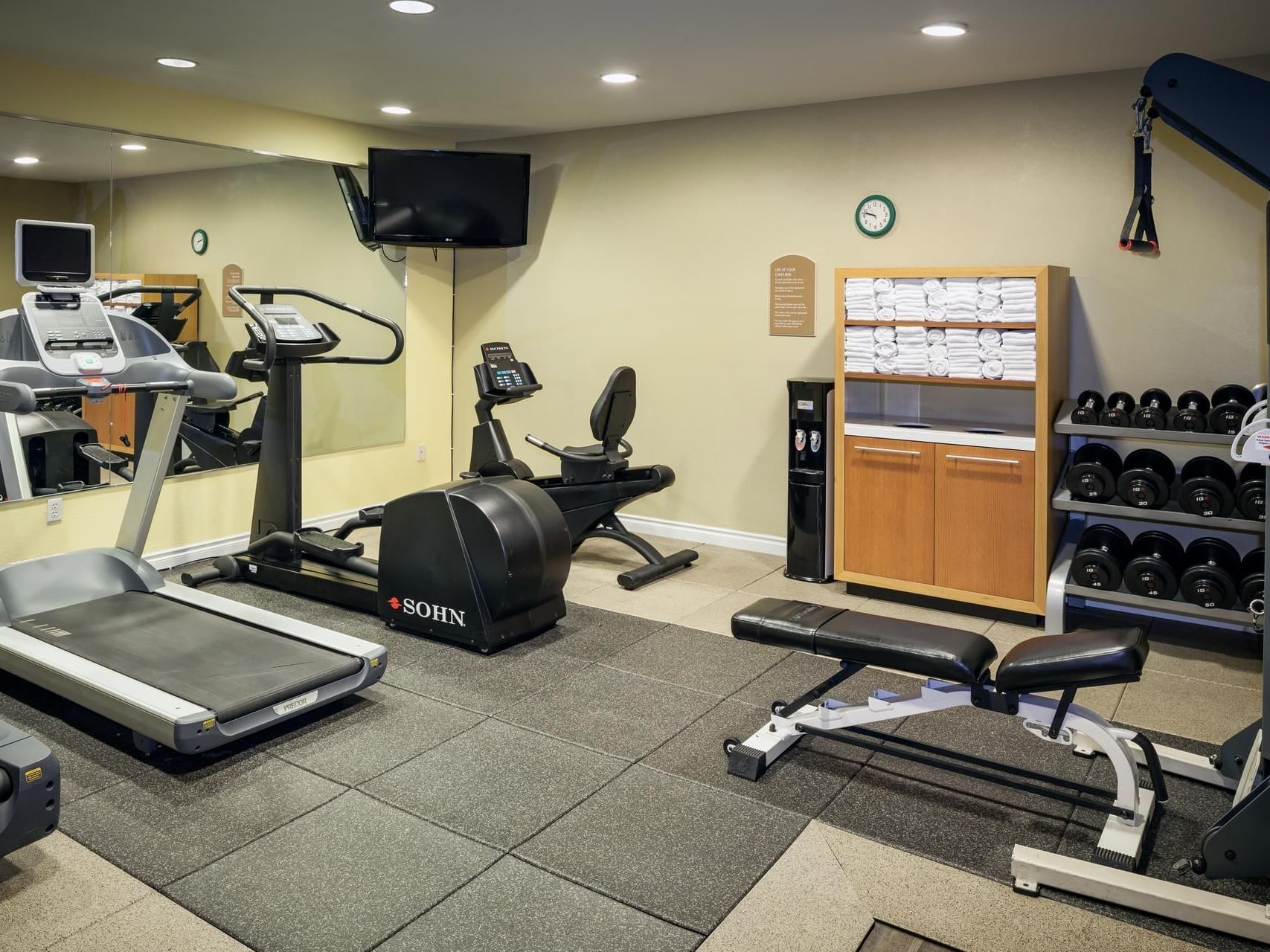 Gym area with treadmills in the fitness center of Plaza Inn & Suites at Ashland Creek​