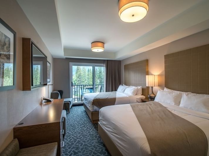 Interior of Premium Double Queen bedroom at Malcolm Hotel