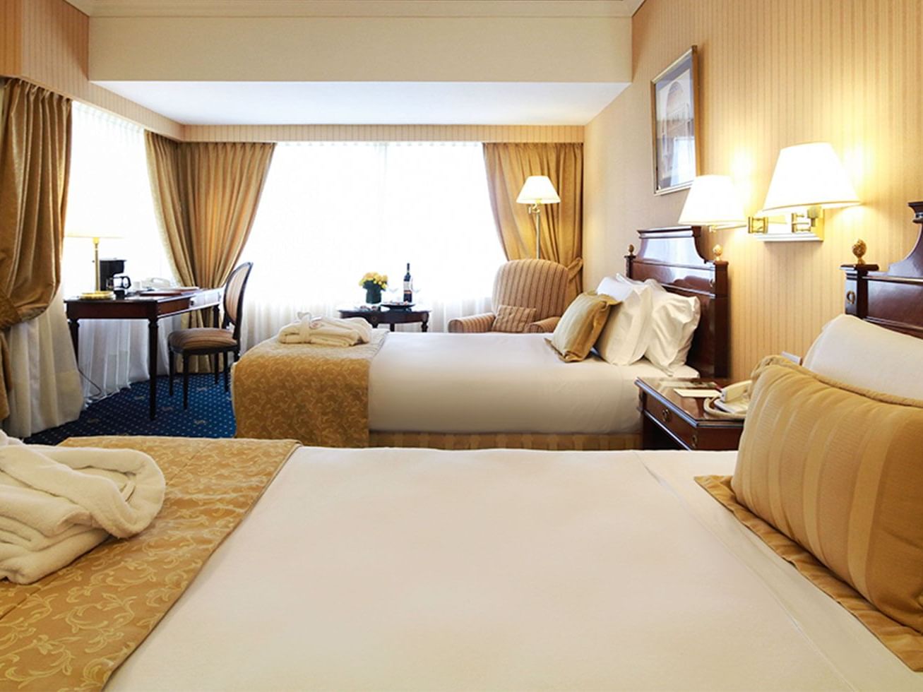 Two beds at Deluxe Executive Room in Hotel Emperador Buenos