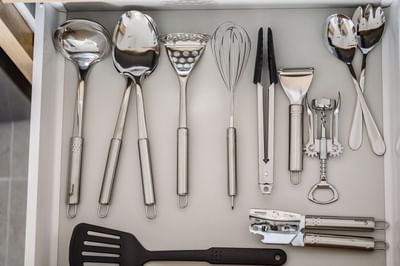 Kitchenware's on kitchen cabinet drawer at Nesuto Docklands