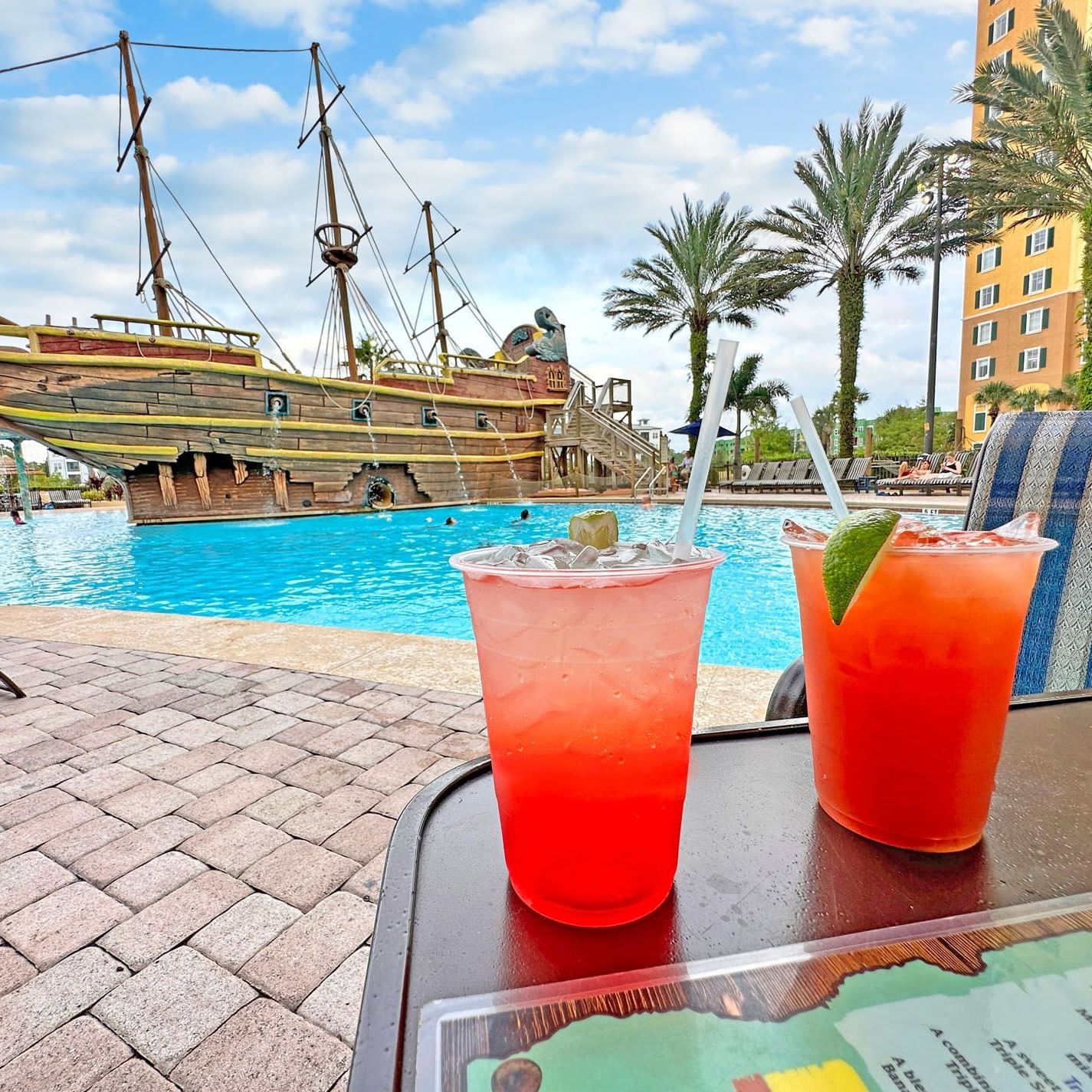 Close-up of cocktails served by the pool deck at Lake Buena Vista Resort Village & Spa