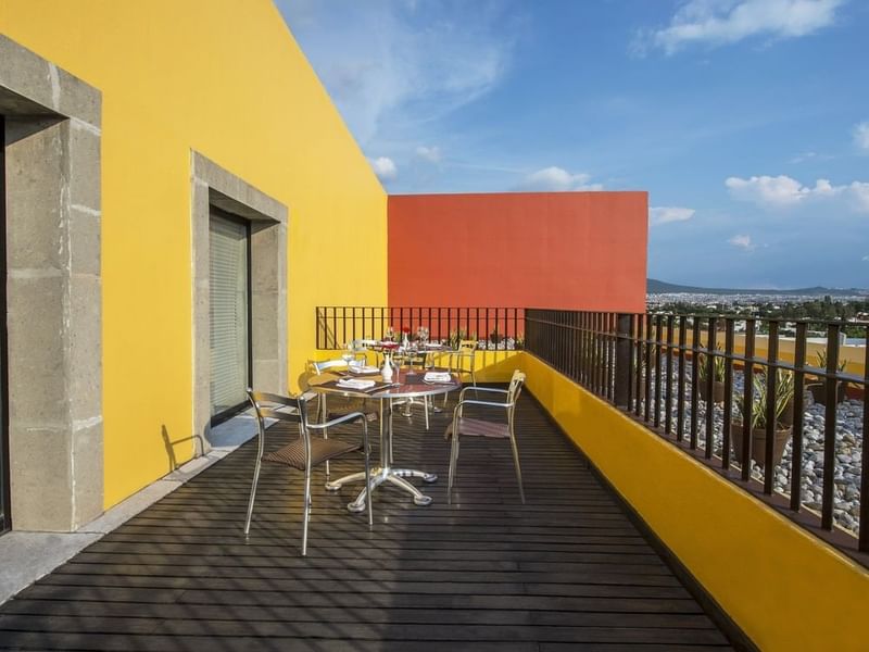 Balcony with elegant seating arrangement in the Master Suite,1 King at Grand Fiesta Americana