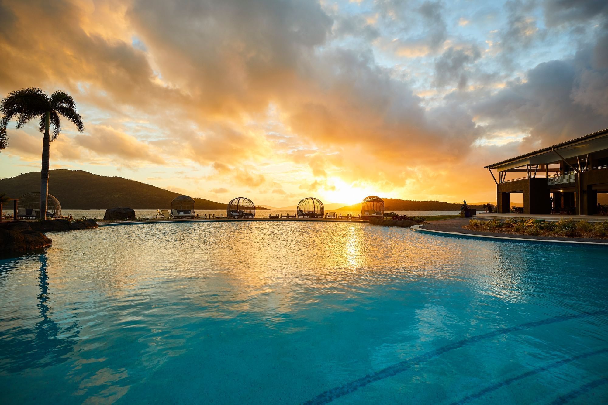 View of the pool during the sunset at Daydream Island Resort