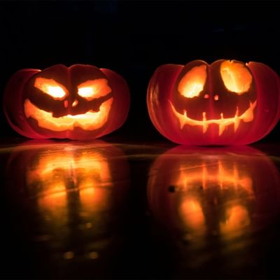 Two cheerful carved pumpkins displaying smiley faces symbolizing Halloween at Falkensteiner Hotel Montafon