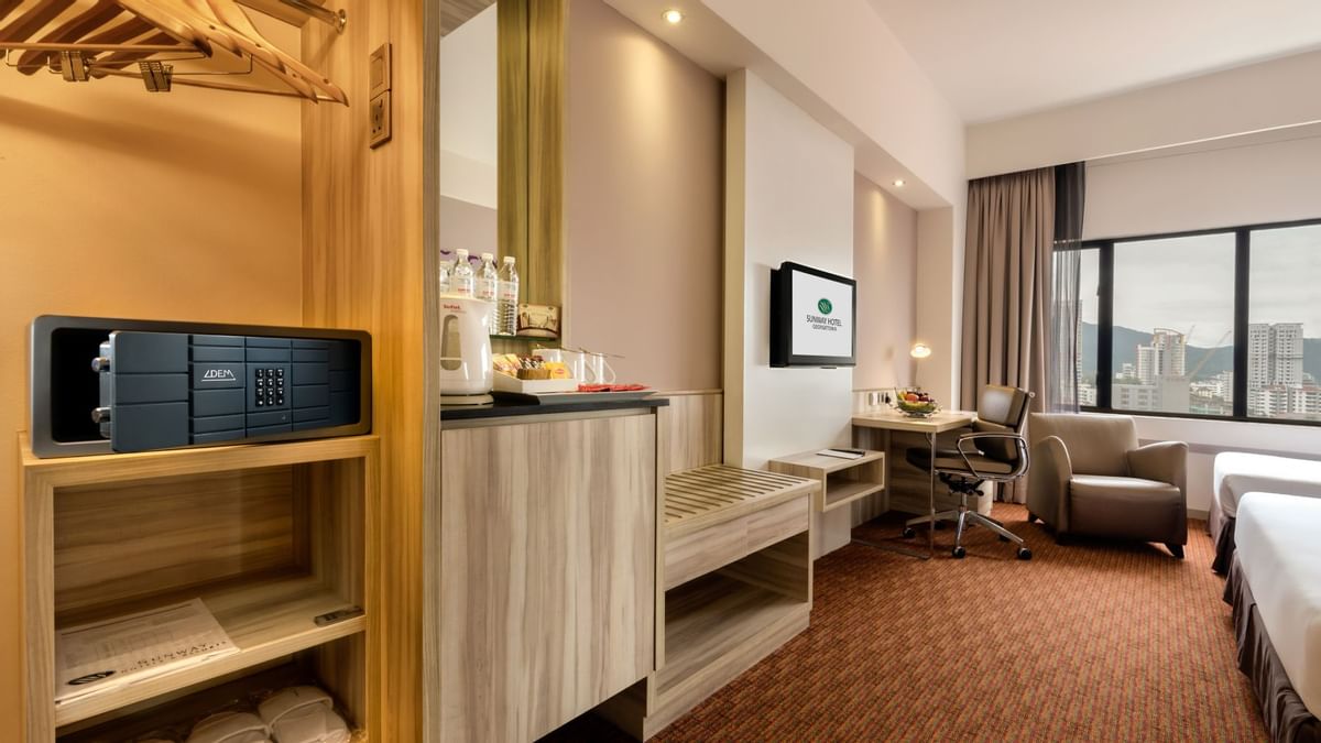 Luxury king bed in Lake Villa with wooden floors at The Banjaran Hotsprings Retreat