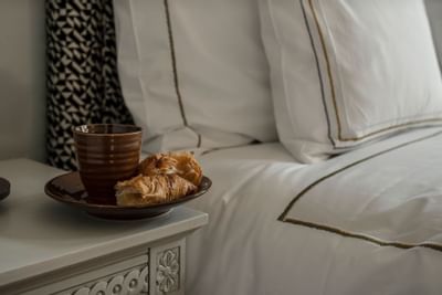 Hot chocolate & croissants served by a bed at The Sparrow Hotel