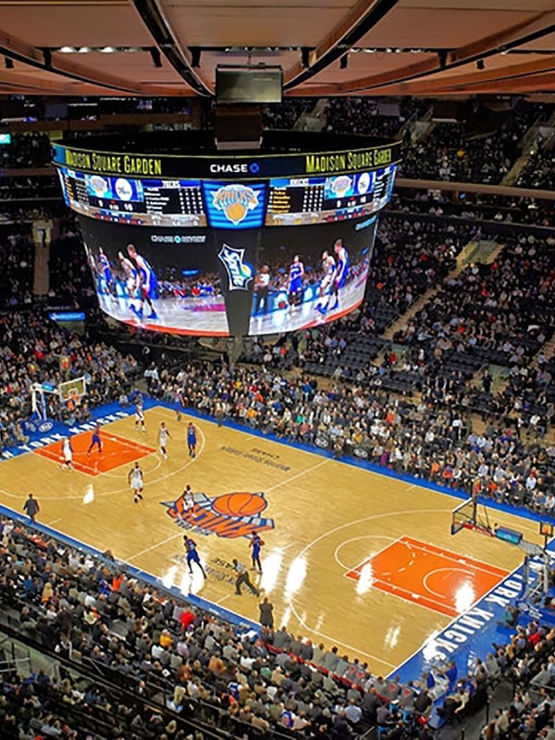 Basketball court at Madison Square Garden with players running by the court near Warwick New York