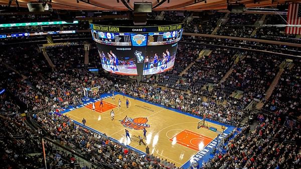 Basketball court at Madison Square Garden with players running by the court near Warwick New York