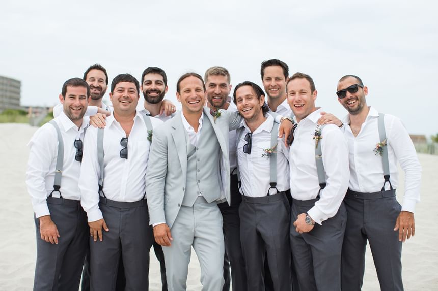 Groom and groomsmen pose for a photo at our Diamond Beach wedding venue