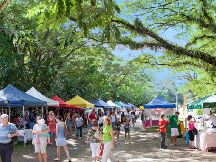 Mossman Markets with tents and people browsing near Pullman Port Douglas Sea Temple Resort & Spa