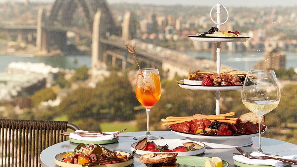 Two-tiered platter of charcuterie and desserts in CIRQ at Crown Towers Sydney