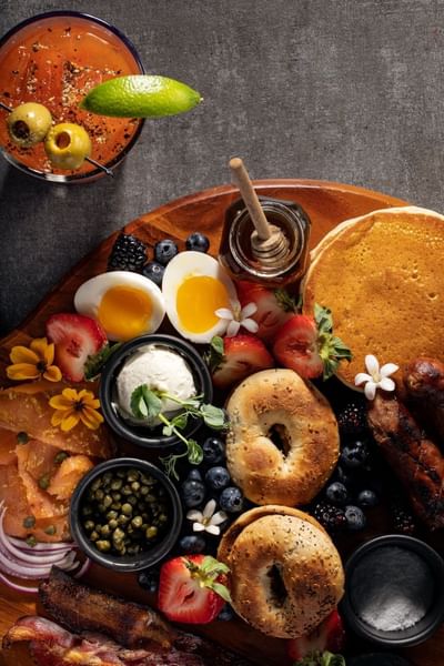 Beautiful and delicious brunch platter with bagels, eggs, and pancakes at The Boulevard Inn & Bistro