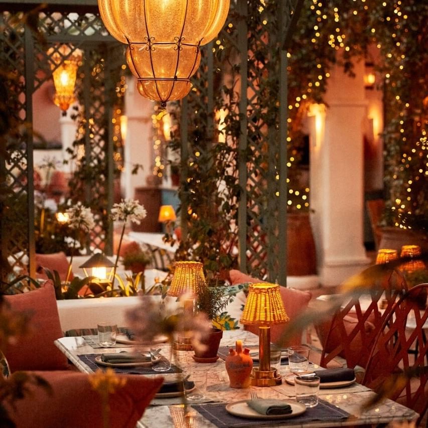 Romantic dining area with candles and lanterns set for Valentine's Day at El Patio.