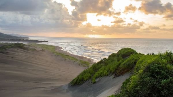 Sigatoka Sand Dunes National Park with Golden sunset by rolling sand dunes near the ocean near The Naviti Resort - Fiji