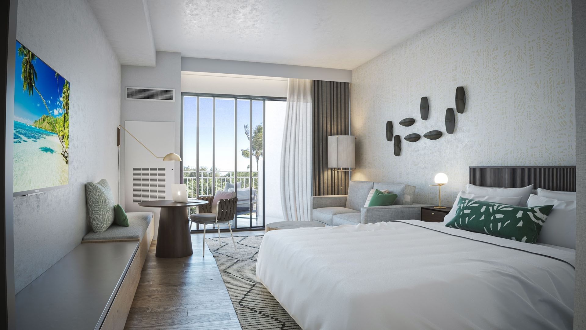 A hotel room with a large bed, sofa, desk, and balcony