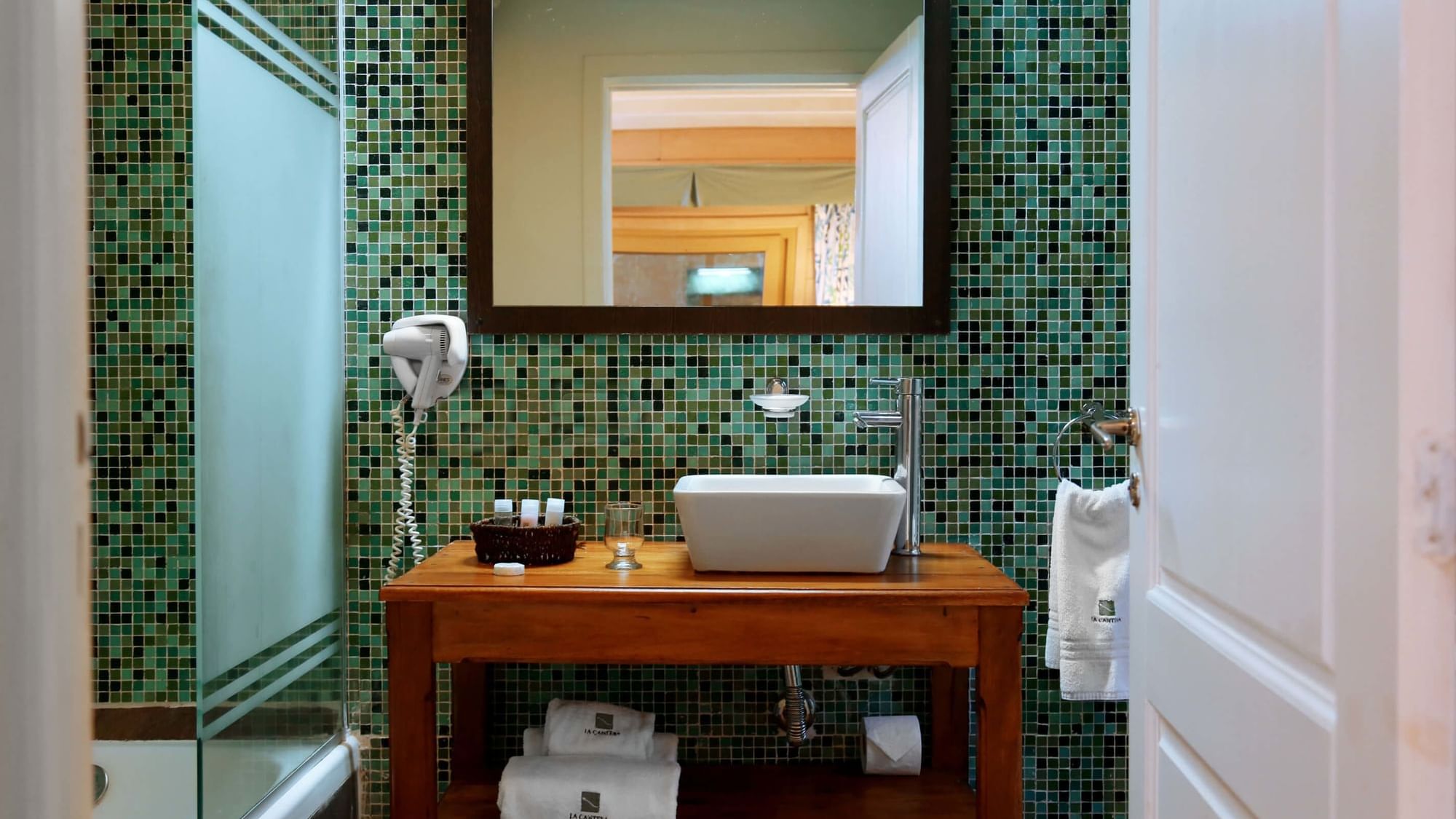 The Bathroom vanity area in Tierra room at DOT Hotels