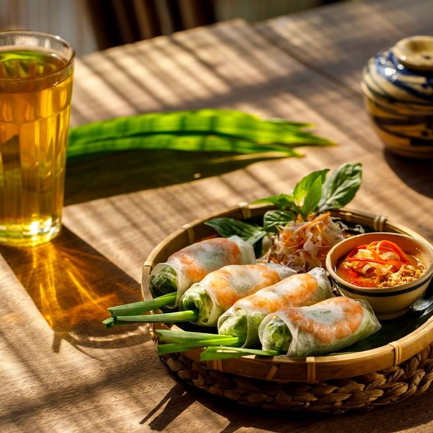 Shrimp rolls served by a herbal drink in Traditional Vietnamese Food near Eastin Hotels