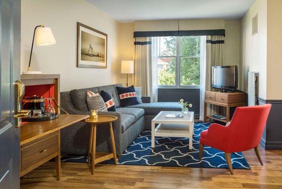 TV lounge area in a room with wooden floors at Portland Harbor Hotel
