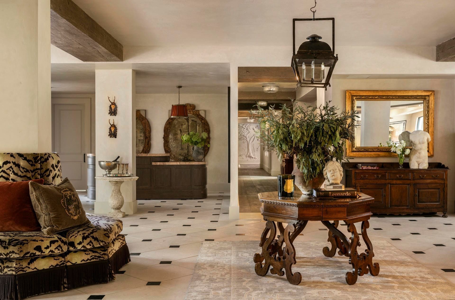 Granduca Houston lobby, showcasing refined décor, curated art, and circular seating, upscale hotels in Houston