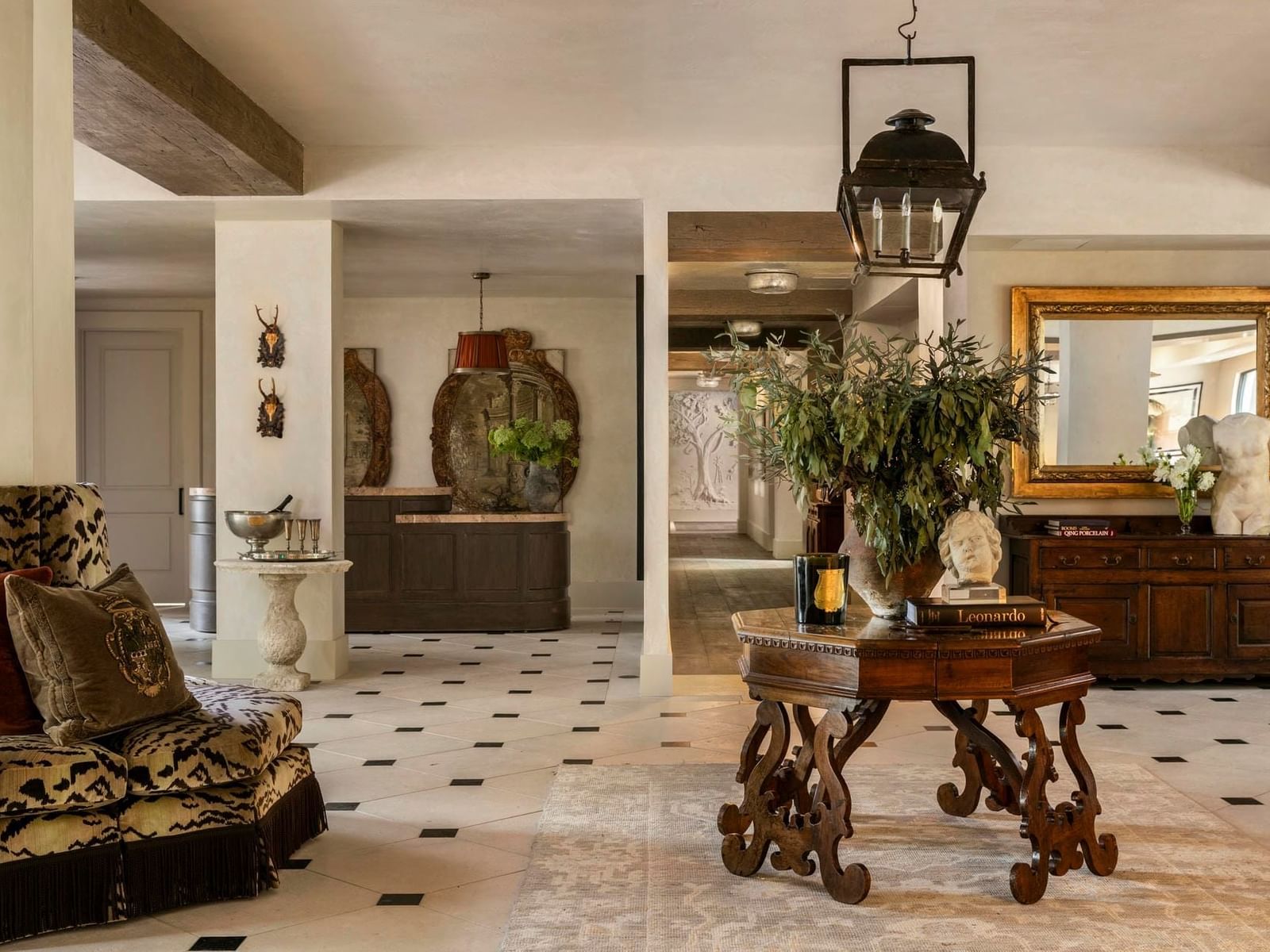 Granduca Houston lobby, showcasing refined décor, curated art, and circular seating, upscale hotels in Houston