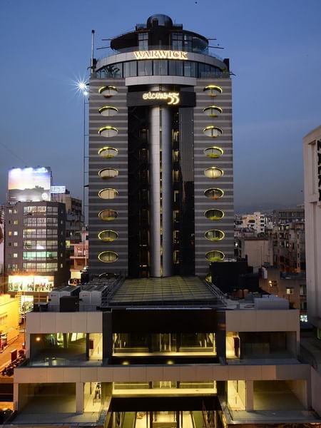 Exterior view of Rooftop Restaurant with oval glowing windows at Warwick Stone 55 - Beirut