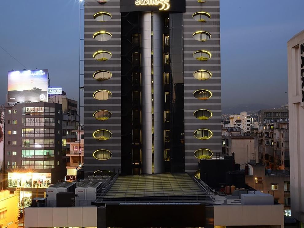 Exterior view of Rooftop Restaurant with oval glowing windows at Warwick Stone 55 - Beirut