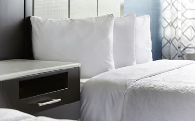 Pillows on bed in Queen Accessible Room at Waterfront Hotel