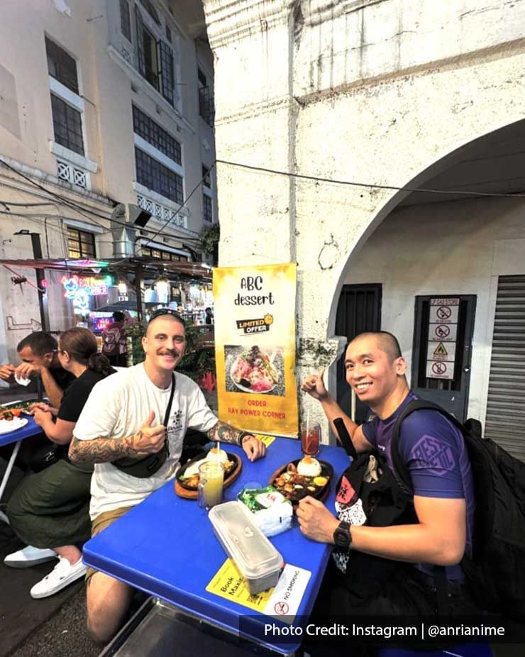 Tourists enjoying meals in Jalan Alor food street at night near Imperial Lexis Kuala Lumpur, Dining in KLCC