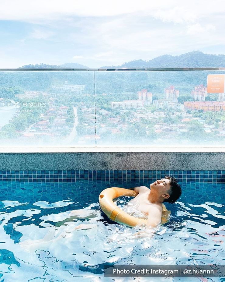 A man chilling in the swimming pool at Lexis Suites Penang