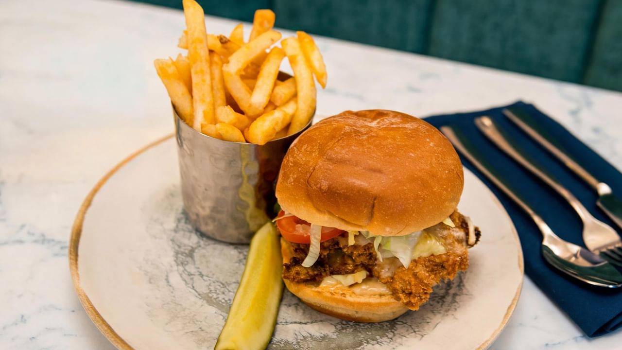 Burger with pickle and fries.